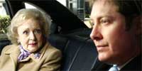 Catherine and Alan contemplate her rubber gun shooting spree